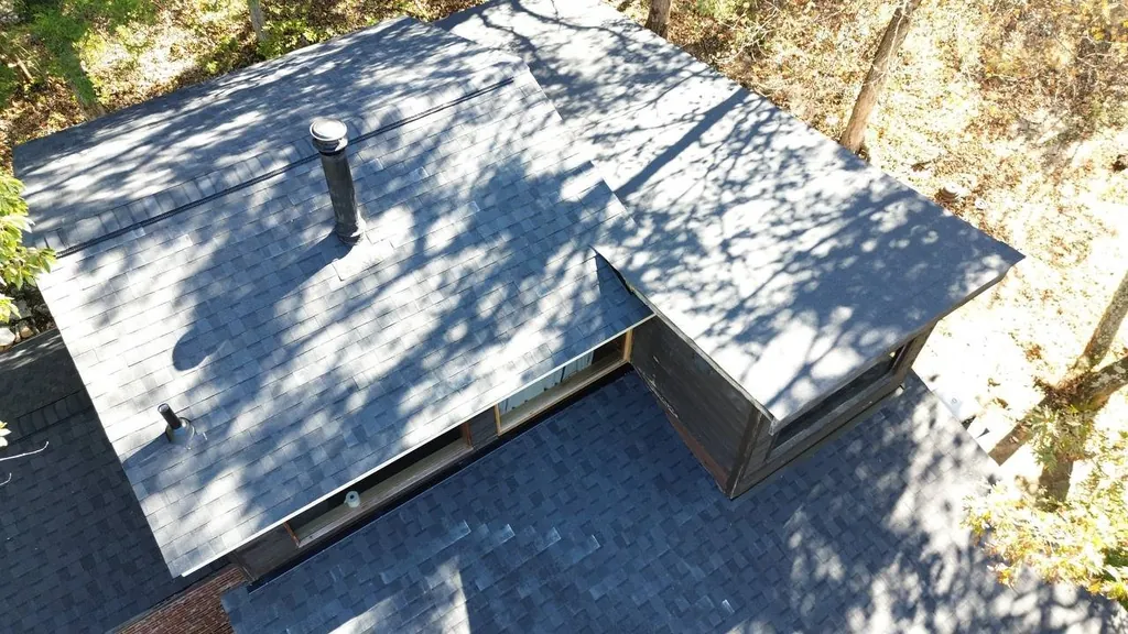 Roof Condition Overview — St. Louis Maintenance Guide Article illustration of a multi-plane asphalt-shingle roof viewed from above
