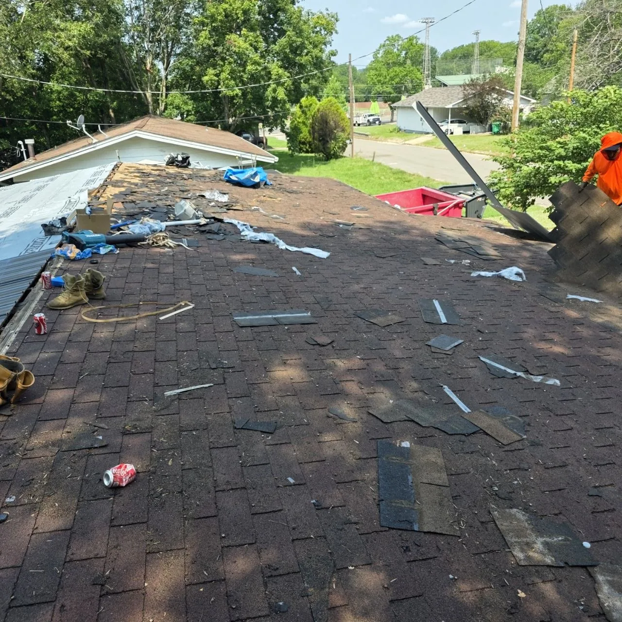 Asphalt Shingle Roof Tear-Off — St. Louis Cost Guide Roofing crew removing aged asphalt shingles during a residential roof tear-off