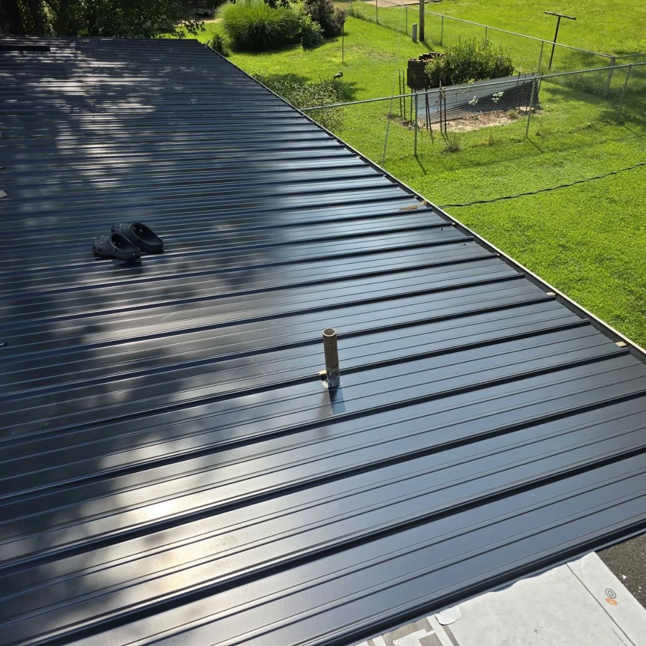 Standing-Seam Metal Roof Surface — St. Louis Cost Guide Standing-seam metal roof surface with a flashed roof penetration