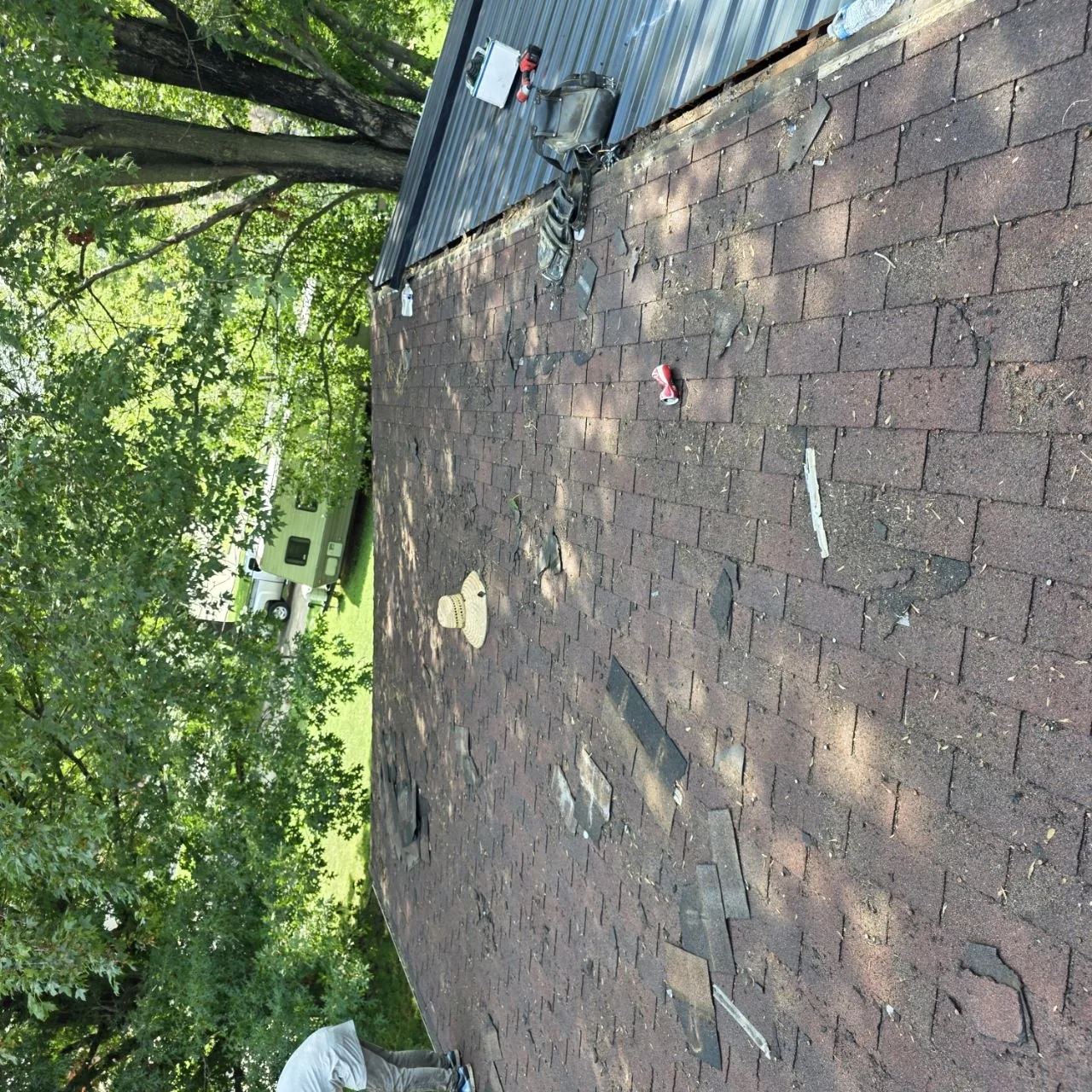 Shingle Condition Inspection — St. Louis Roof Program Close inspection view of worn asphalt shingles before a roofing recommendation