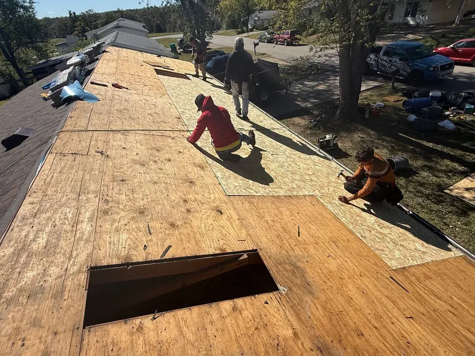 Roof Deck Preparation — Roofing COP Guide Roofing crew preparing roof decking during a replacement project